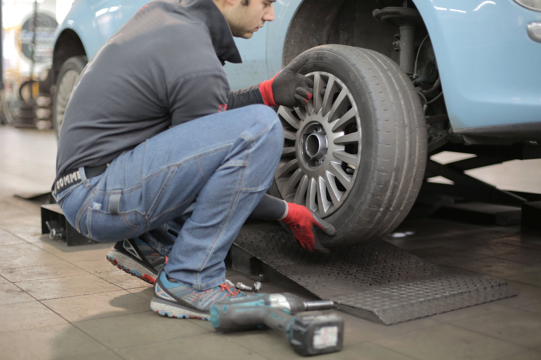 man changing a car tire