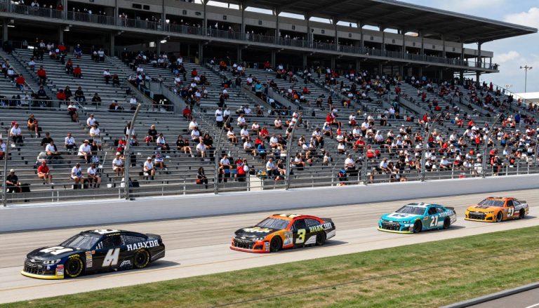 NASCAR race cars racing on an oval track during a Cup Series event